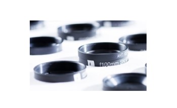 Production of optical components by volume